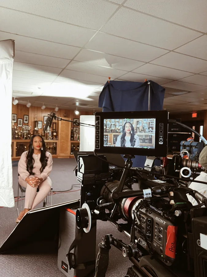 Interview setup with a cinema camera and monitor on a Walmart shoot