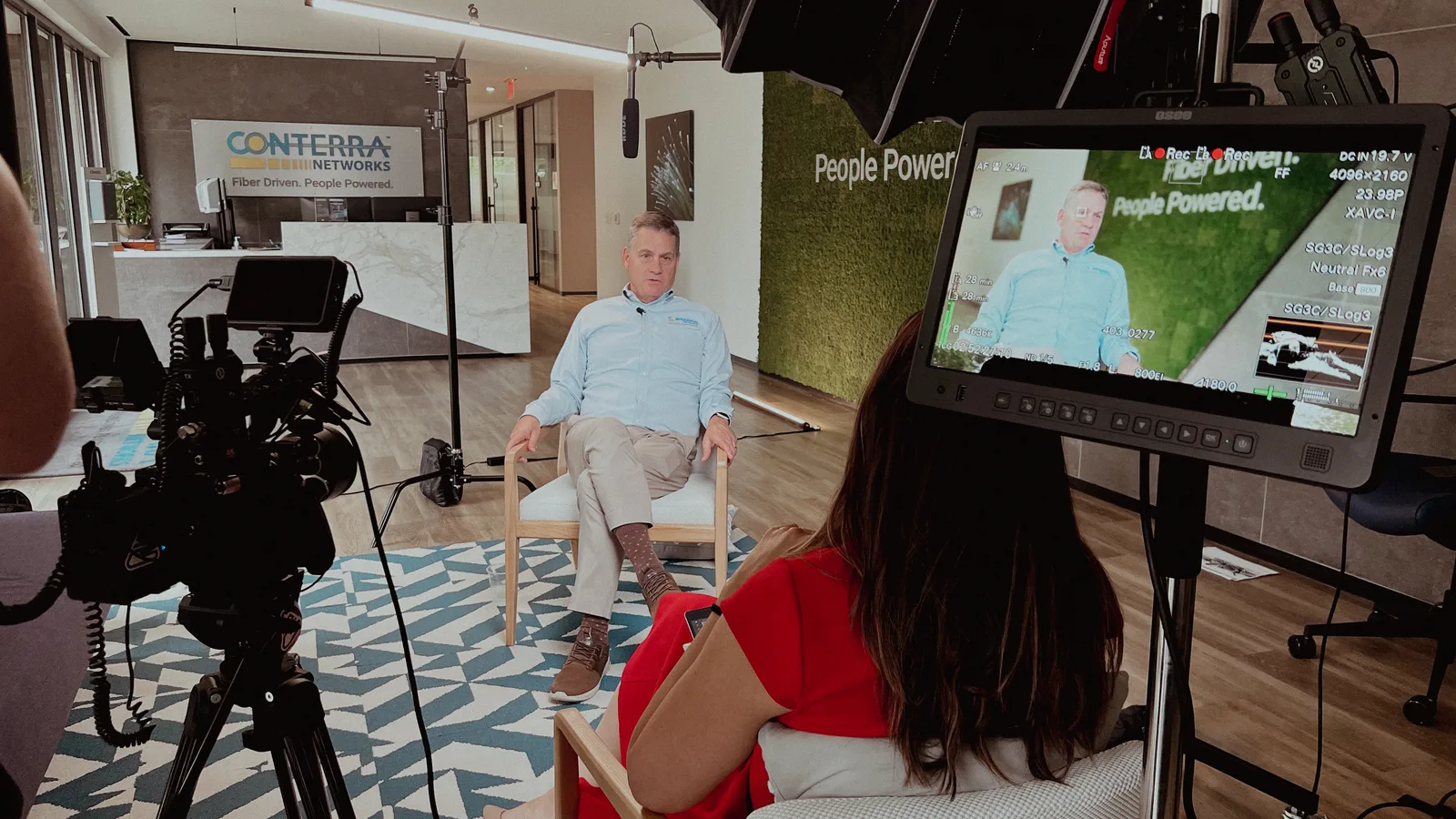 Executive interview lit and framed with a camera monitor in the foreground