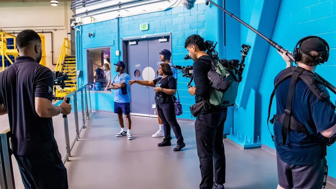 Crew filming an interview on set